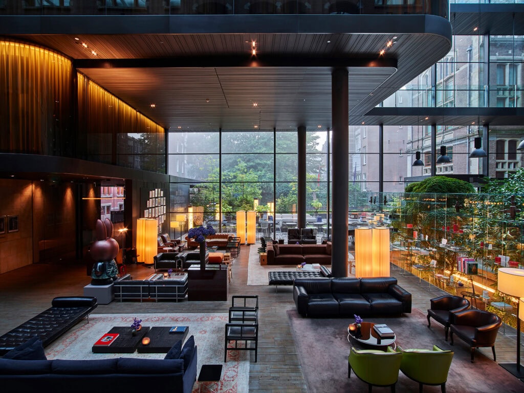 Conservatorium Hotel Amsterdam lobby with glass atrium and designer furniture