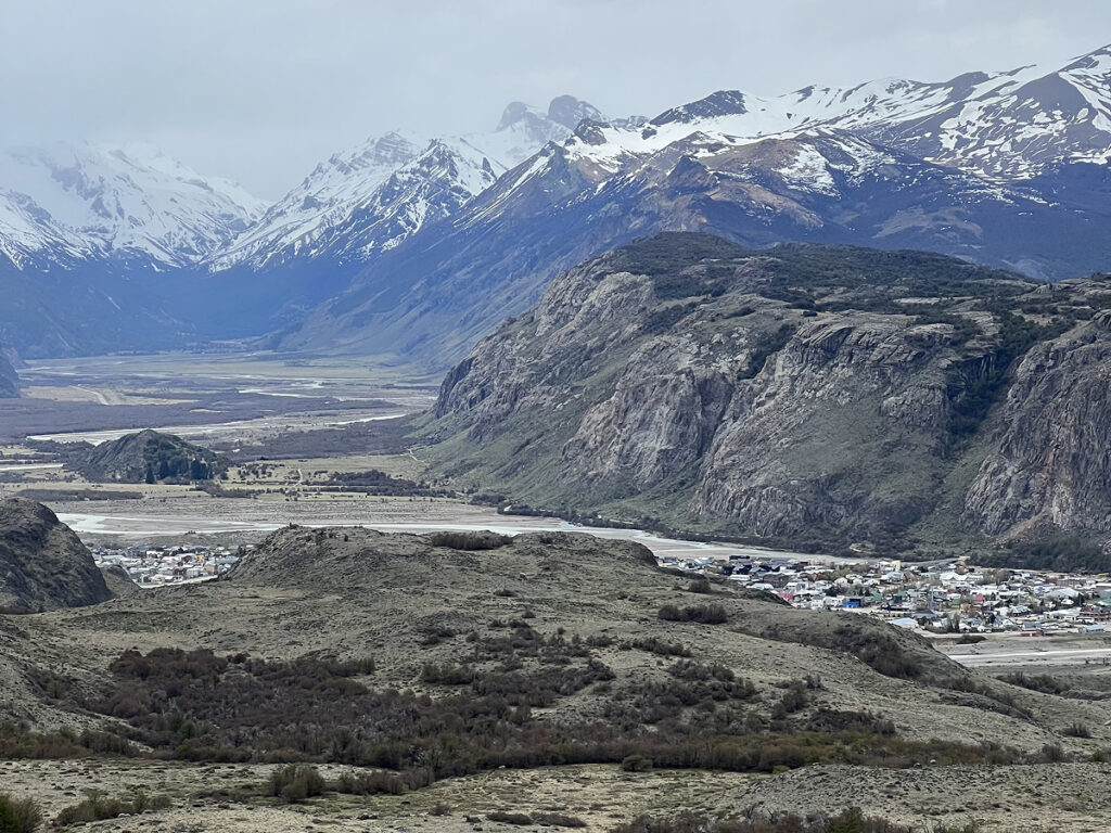 View of El Chaltén from the trail, with mountains and valley in Patagonia