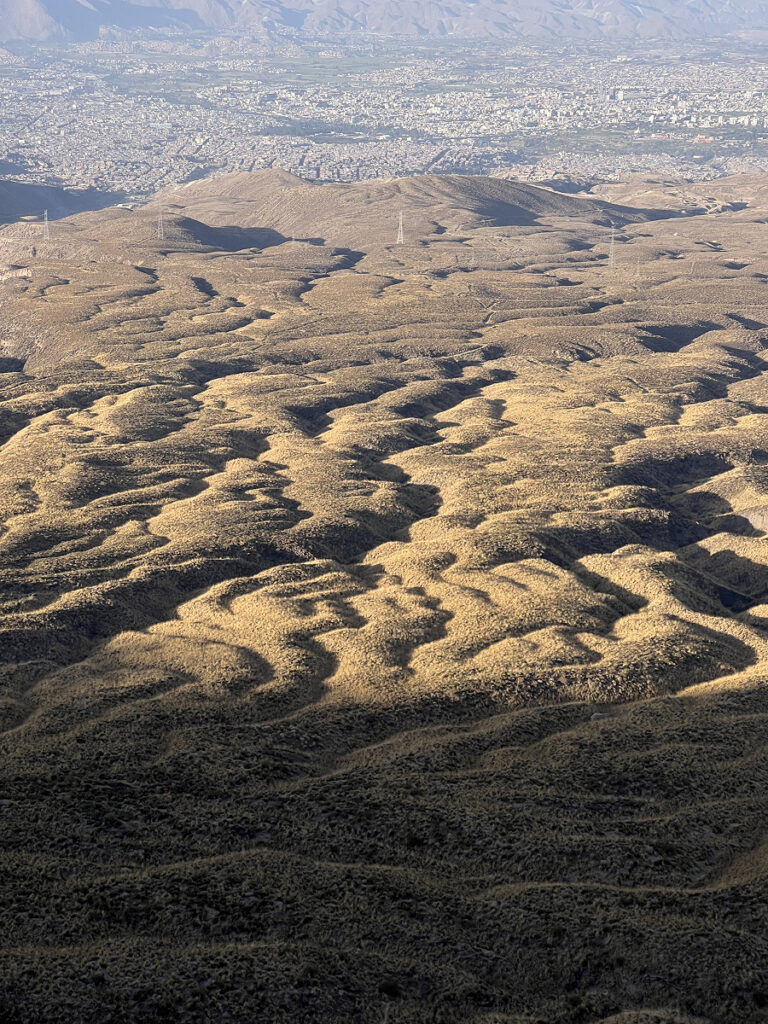 Expansive valley view from the slopes of El Misti during the climb in Arequipa, Peru