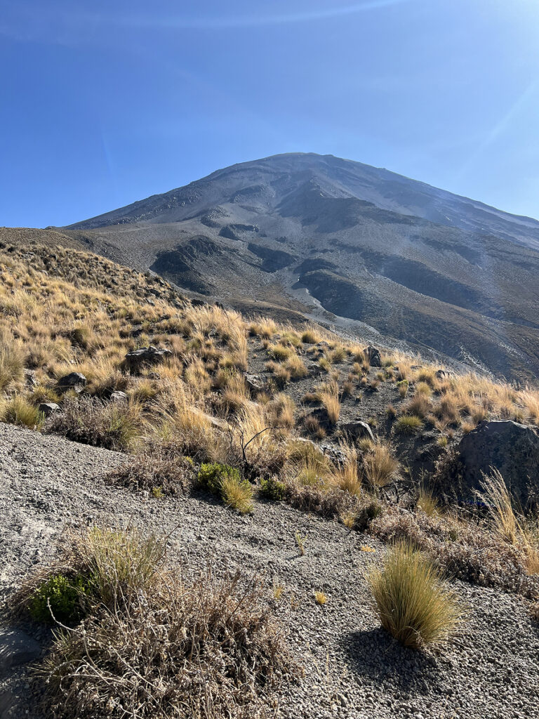 View of volcanic slopes during the El Misti climb in Arequipa, Peru, under clear blue skies