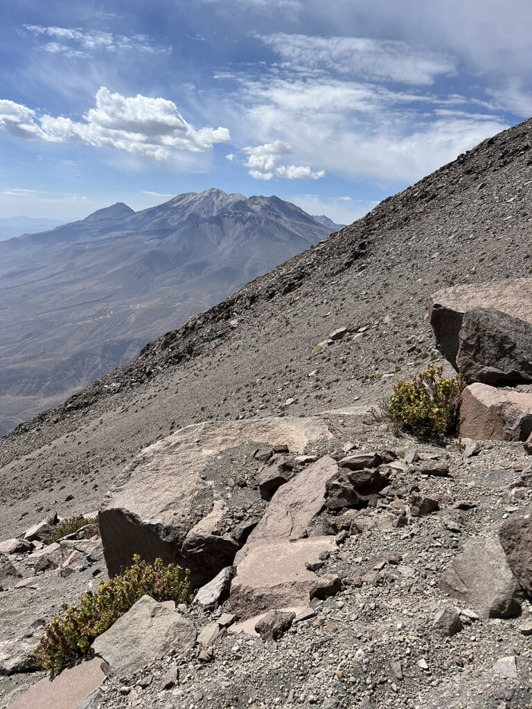 Rocky slope on El Misti climb with views of surrounding volcanoes near Arequipa, Peru