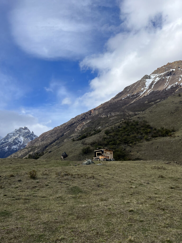 Rustic luxury lodge at Estancia Bonanza near El Chaltén, surrounded by Patagonian mountains