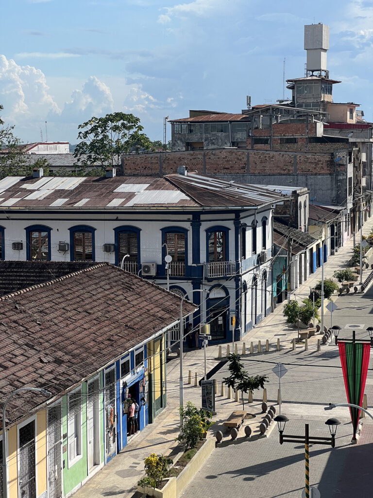 Historic street lined with colorful colonial buildings in Iquitos, Peru