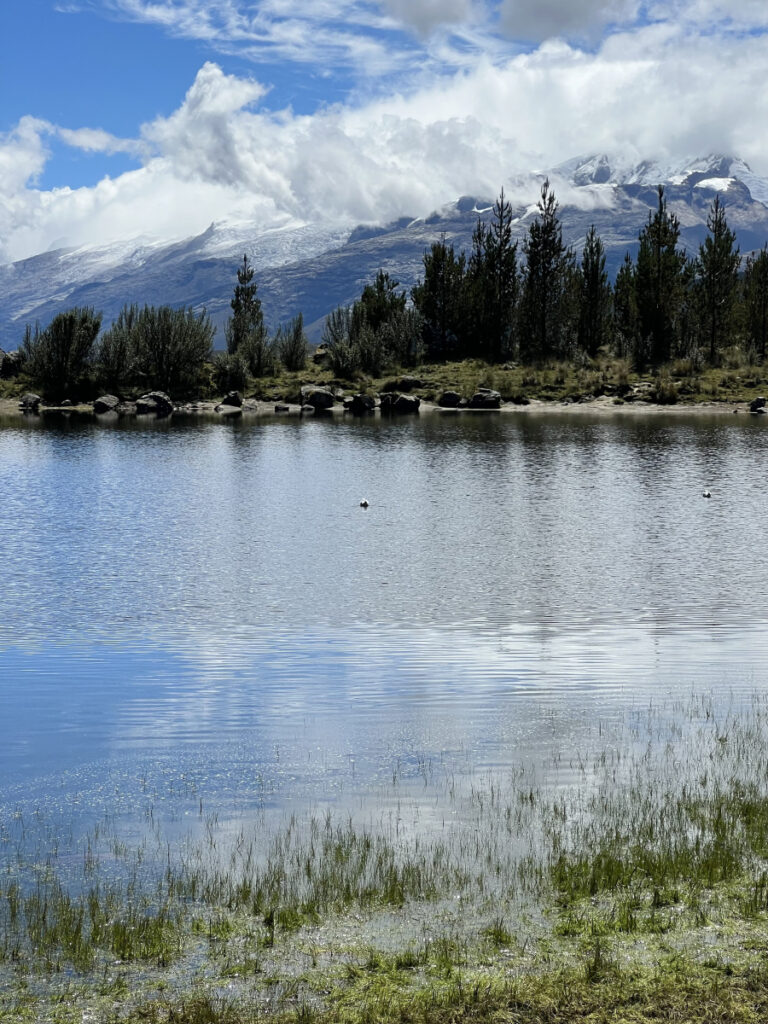 View of Laguna Radian with snow-covered mountains of the Cordillera Blanca in the background