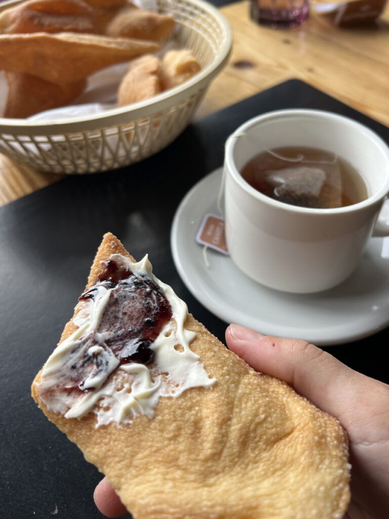 Local pastry with cream cheese and jam served with tea at La Pulpería in Estancia Bonanza, El Chaltén