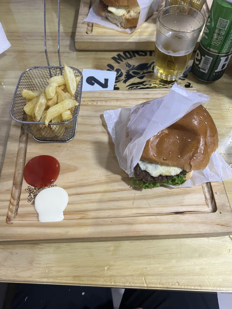 Burger, fries, and beer served at Monster Burger in Huaraz, Peru