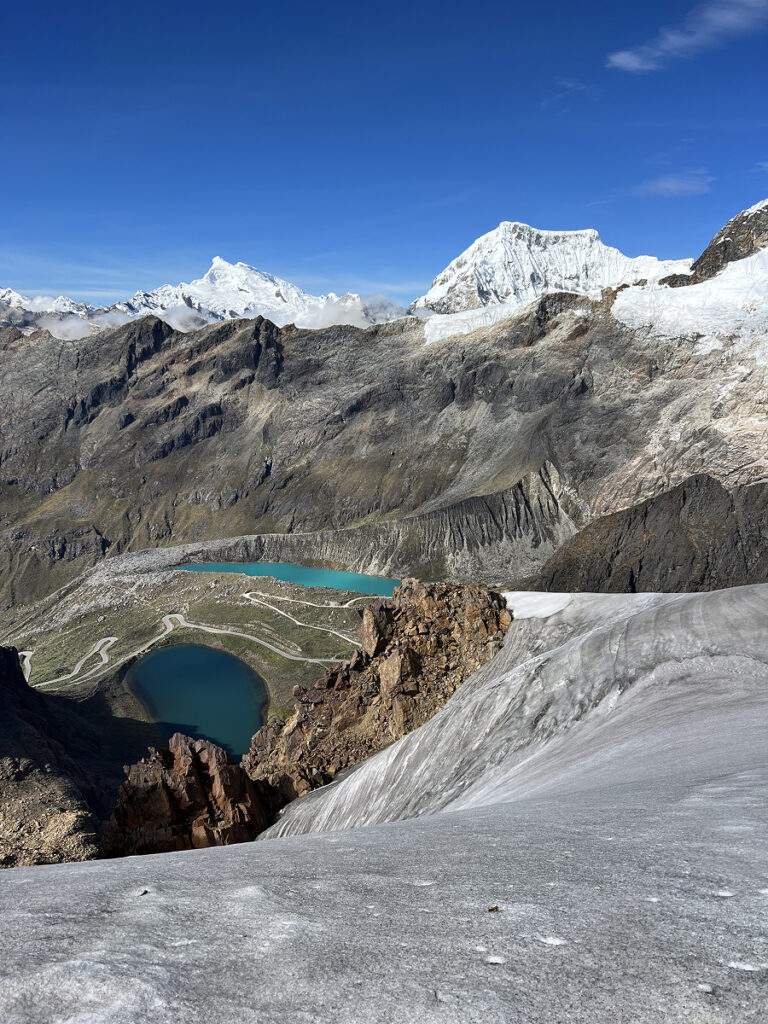 View from Nevado Mateo glacier overlooking turquoise lakes and the dramatic peaks of the Cordillera Blanca