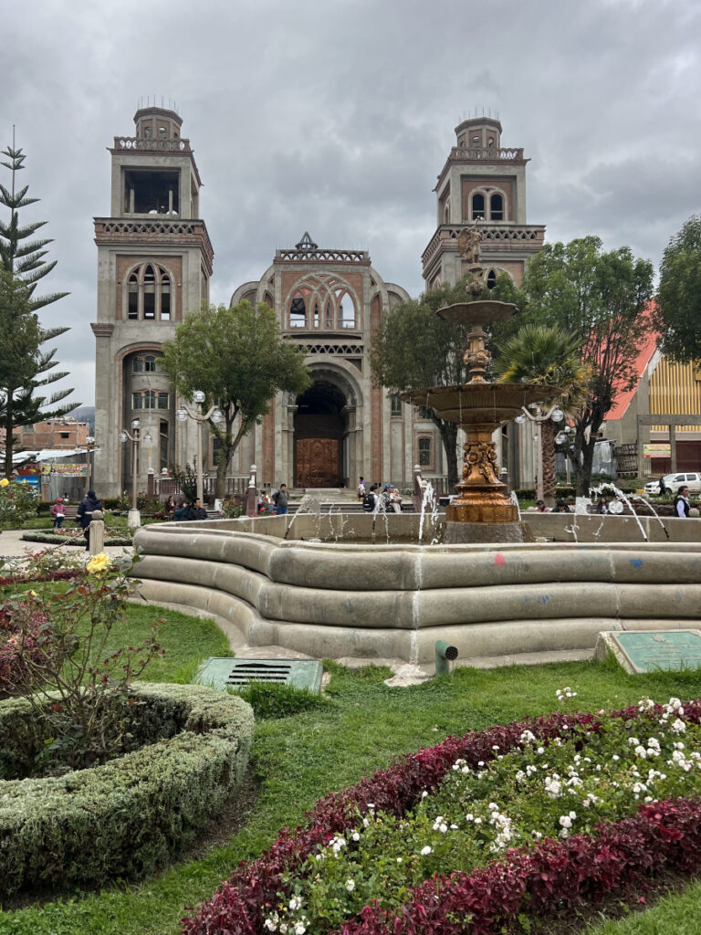 Fountain and cathedral at Plaza de Armas in Huaraz, Peru on a cloudy day